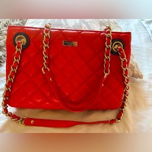 Kate Spade soft leather quilted handbag. Color- coral